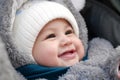 Happy little baby boy making outdoors in winter. Cute toddler in winter cloth. Child having fun on cold day. Winter walk Royalty Free Stock Photo