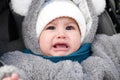 Happy little baby boy making outdoors in winter. Cute toddler in winter cloth. Child having fun on cold day. Winter walk Royalty Free Stock Photo