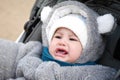 Happy little baby boy making outdoors in winter. Cute toddler in winter cloth. Child having fun on cold day. Winter walk Royalty Free Stock Photo