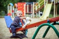 Happy little baby boy playing on the playground in the summer or autumn Royalty Free Stock Photo