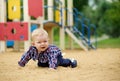 Happy little baby boy playing on the playground in the summer or Royalty Free Stock Photo