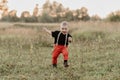 Happy little baby boy running on summer grass Royalty Free Stock Photo
