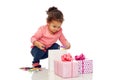 Happy little baby girl with birthday presents