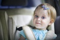Happy little baby girl in the car seat Royalty Free Stock Photo