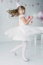 happy little birthday girl in white dress
