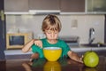 Happy little blond kid boy eating cereals for breakfast or lunch. Healthy eating for children. Child having breakfast Royalty Free Stock Photo