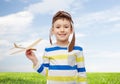 Happy little boy in aviator hat with airplane Royalty Free Stock Photo