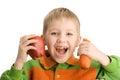 Happy little boy biting apple and carrot Royalty Free Stock Photo