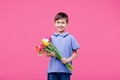 Happy little boy with a bouquet of tulips Royalty Free Stock Photo