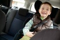 Happy little boy in car safety seat. Royalty Free Stock Photo