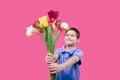 Happy little boy child with a bouquet of tulips flowers Royalty Free Stock Photo