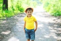 Happy little boy child in hat walking in summer