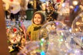 Happy little boy at christmas market in winter Royalty Free Stock Photo