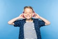 happy little boy with closed eyes listening music in headphones Royalty Free Stock Photo