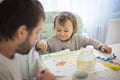 Happy little boy with dad sitting at the table and painting, Creativity Royalty Free Stock Photo