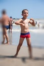 Happy little boy dance on beach at the day time Royalty Free Stock Photo