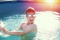 Happy little boy enjoying summer holiday in swimming pool Royalty Free Stock Photo