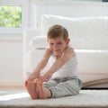 Happy little boy exercising at home Royalty Free Stock Photo