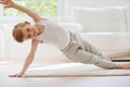 Happy little  boy exercising at home Royalty Free Stock Photo