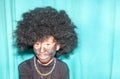 Happy little boy with face painted with charcoal and afro wig cos Royalty Free Stock Photo