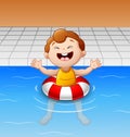 Happy little boy floating in swimming pool with inflatable circle Royalty Free Stock Photo