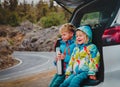 Happy little boy and girl enjoy travel by car Royalty Free Stock Photo