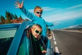 Happy little boy and girl enjoy travel by car in mountains Royalty Free Stock Photo