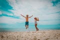 Happy little boy and girl jump on beach Royalty Free Stock Photo