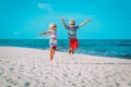 Happy little boy and girl play on beach, kids enjoy tropical vacation Royalty Free Stock Photo