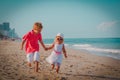 Happy little boy and girl run play at beach Royalty Free Stock Photo