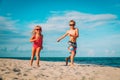 Happy little boy and girl run play at beach Royalty Free Stock Photo