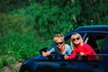 Happy little boy and girl travel by car Royalty Free Stock Photo