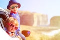 Happy little boy and girl travel by car in Royalty Free Stock Photo