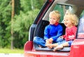 Happy little boy and girl travel by car Royalty Free Stock Photo