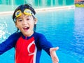 Happy little boy has fun and enjoy in the swimming pool Royalty Free Stock Photo