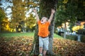 Happy little boy have fun playing with fallen golden leaves Royalty Free Stock Photo