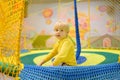 Happy little boy having fun in amusement in play center. Child playing on indoor playground Royalty Free Stock Photo