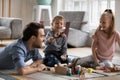 Happy little boy having fun with father and elder sister at home. Royalty Free Stock Photo