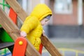 Happy little boy having fun on outdoor playground