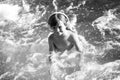 Happy little boy having fun in summer swimming pool. Family vacation. Royalty Free Stock Photo