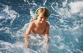 Happy little boy having fun in summer swimming pool. Family vacation. Royalty Free Stock Photo