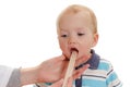 Happy little boy, health exam at doctor's office. On white background Royalty Free Stock Photo