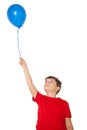 Happy little boy holding blue balloon Royalty Free Stock Photo