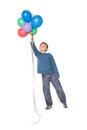 Happy little boy holding bunch of balloons Royalty Free Stock Photo