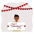 Happy little boy holding a poster with text Happy Valentine's Day and red hearts. Love concept. Happy Valentine Royalty Free Stock Photo