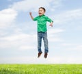 Happy little boy jumping in air Royalty Free Stock Photo