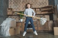 happy little boy jumping with mop Royalty Free Stock Photo