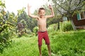 Happy little boy is jumping under rain Royalty Free Stock Photo