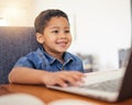 Happy little boy, laptop and elearning in virtual classroom at home for education, learning or communication. Face of Royalty Free Stock Photo