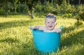 Happy little boy looking out from swimming pool